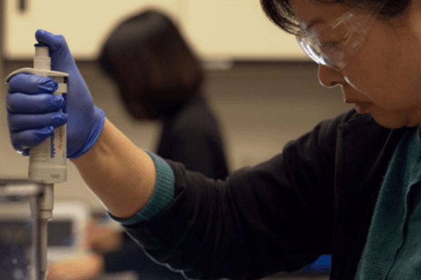Scientist with Pipette